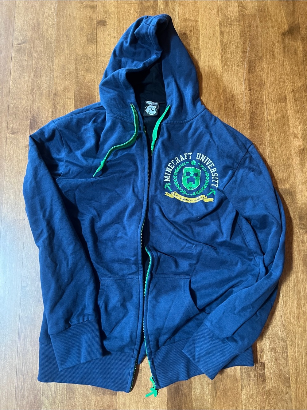 Men’s Minecraft University Navy Blue Graphic Hoodie with Green and Gold Crest